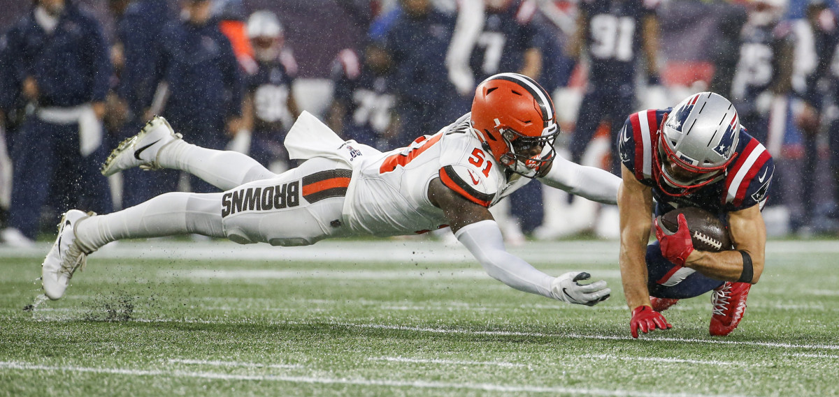 Browns linebacker Mack Wilson dives to tackle Patriots wide receiver Julian Edelman during a 2019 game. Wilson was on the verge of breaking out as the next Browns star linebacker, but he was traded to the Patriots in 2022.